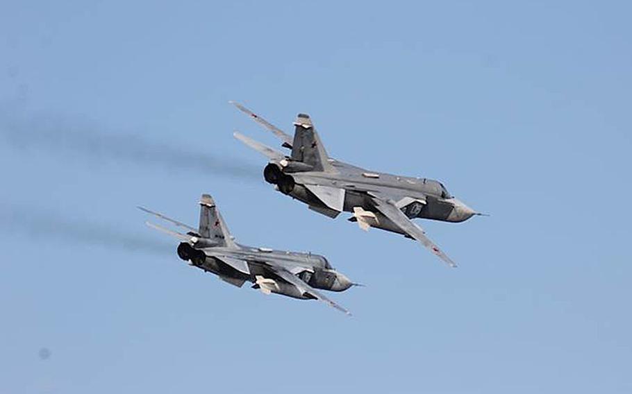 Two Russian Sukhoi Su-24 attack aircraft fly over the USS Donald Cook in the Baltic Sea in April 2016. NATO will consider a Russian proposal to develop a plan to improve air safety around the Baltics, where close encounters with alliance and Russian aircraft have caused concern amid heightened tensions between the old Cold War rivals.