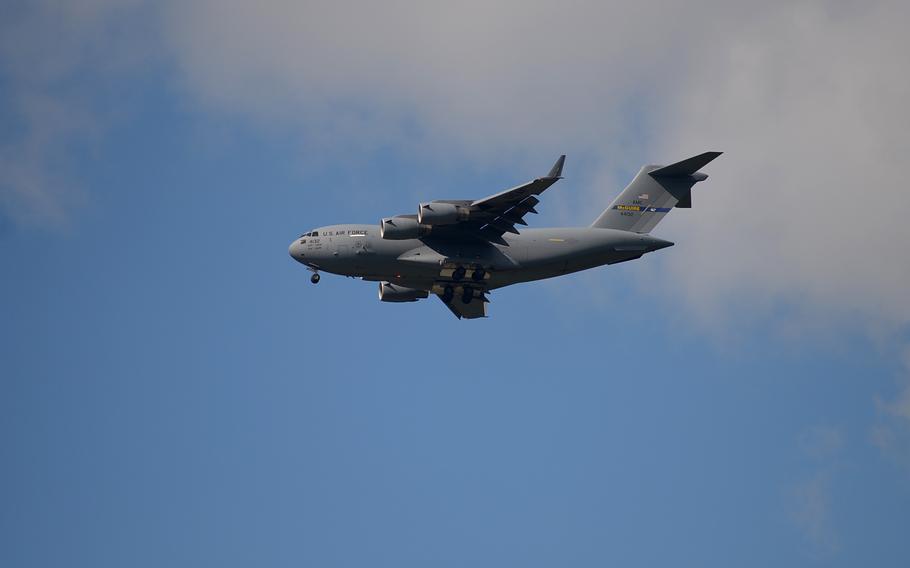 A U.S. Air Force C-17 flies over Kaiserslautern, Germany, on its way to nearby Ramstein Air Base. A pilot of a C-17 landing at Ramstein was blinded by laser beam early Friday morning, according to German police. The plane landed safely.
                