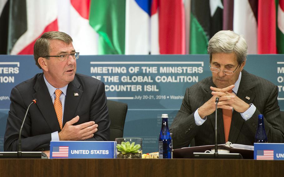 Secretary of Defense Ash Carter, sitting next to Secretary of State John Kerry, address ministers of defense during the Global Coalition to Counter ISIL in Washington, July 21, 2016.