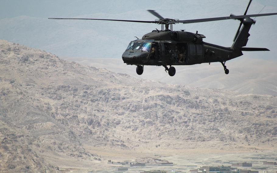 U.S. Army aviators from 4th Combat Aviation Brigade, 4th Infantry Division, fly soldiers from 3d Cavalry Regiment over Jalalabad City and the surrounding area during an aerial tour of the Train, Advise and Assist Command-East area of operation. The aerial tour was part of Brig. Gen. Charles Cleveland's visit to TAAC-E in Nangarhar Province, Afghanistan, June 28, 2016.