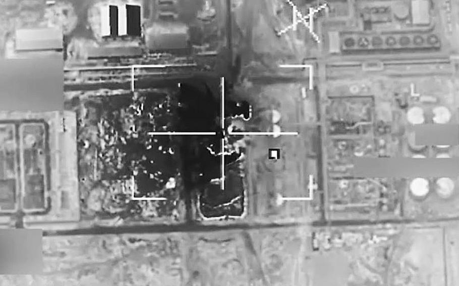 A video screen grab shows a coalition airstrike targeting Islamic State fighters near al-Qaim, Iraq, on April 29, 2016.