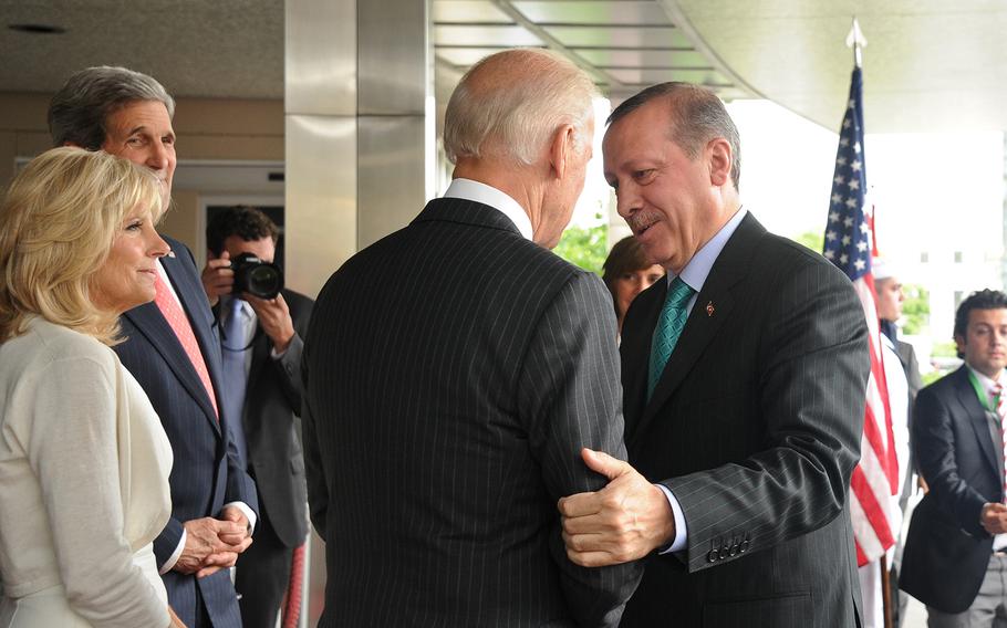 Turkish Prime Minister Recep Tayyip Erdogan, right, shakes hands with U.S. Vice President Joe Biden during a ceremony in Washington, D.C., on May 16, 2013, as Biden's wife Jill and U.S. Secretary of State John Kerry look on.