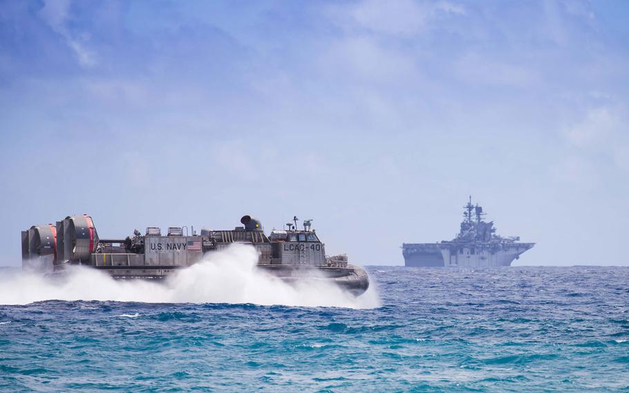 An LCAC hovercraft zooms through the water during an amphibious assault on Pyramid Rock Beach in Hawaii July 30, 2016.