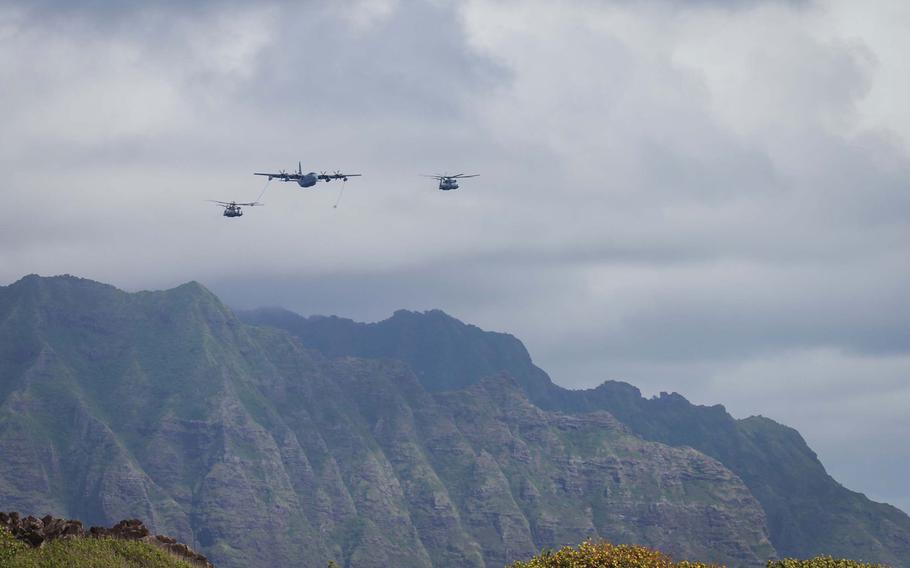 Aircraft fly in support the amphibious landing that culminated the Rim of the Pacific exercise July 30, 2016, at Marine Corps. Base Hawaii.
                