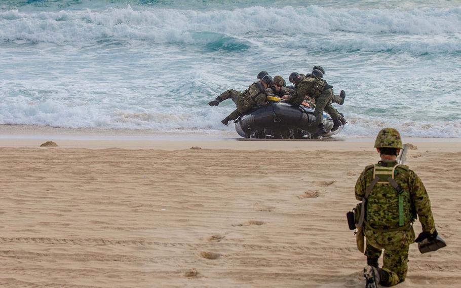 Members of the Japan Ground Self-Defense Force land on Pyramid Rock Beach with Company E, Battalion Landing Team 2nd Battalion, 3rd Marines, July 30, 2016.
                