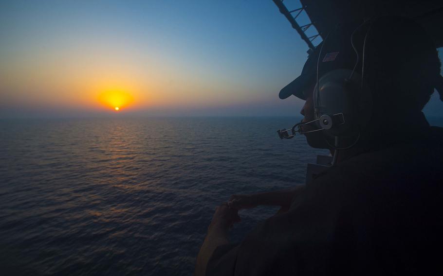 A U.S. sailor watches aboard the guided-missile cruiser USS Monterey on Aug. 30, 2016, while deployed as part of the Eisenhower Carrier Strike Group in the Persian Gulf. Navy assets in the region have seen an escalation of tensions with Iran. On Tuesday, Sept. 13, the Navy reported that Iran had threatened to fire on two U.S. Navy aircraft in three separate incidents last weekend.