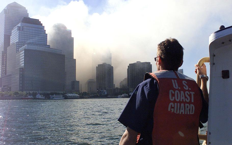 Coast Guard crewmembers patrol the harbor after the collapse of the World Trade Center in New York on Sept. 11, 2001. The Senate on Wednesday, Sept. 28, 2016, voted to override President Barack Obama's veto of a bill that would allow families of the victims of the 9/11 attacks to sue the government of Saudi Arabia.