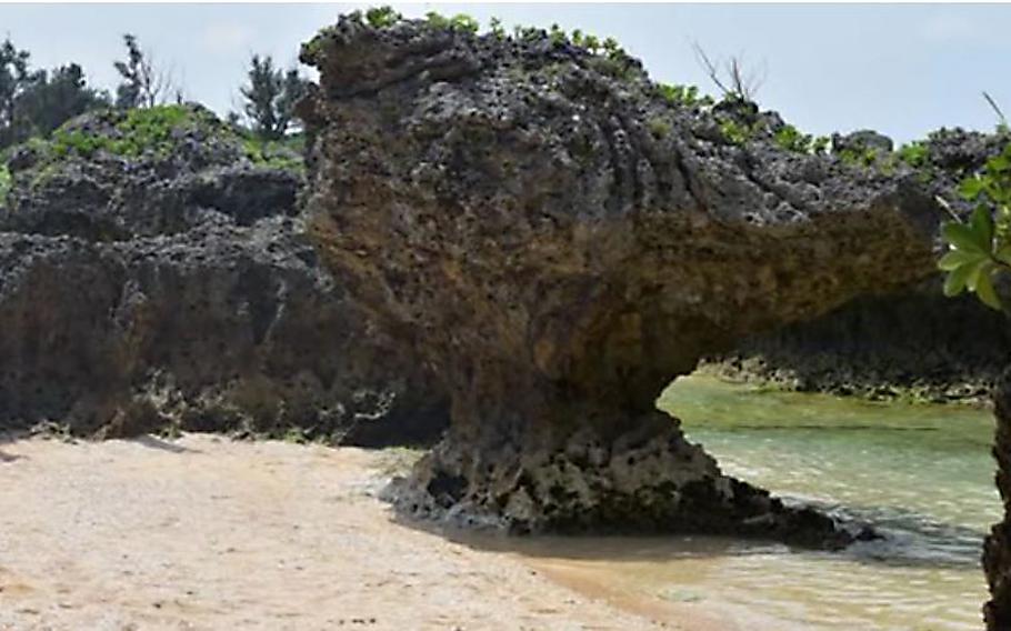 A video screen grab shows a beach shot near Okinawa's Maeda Point.