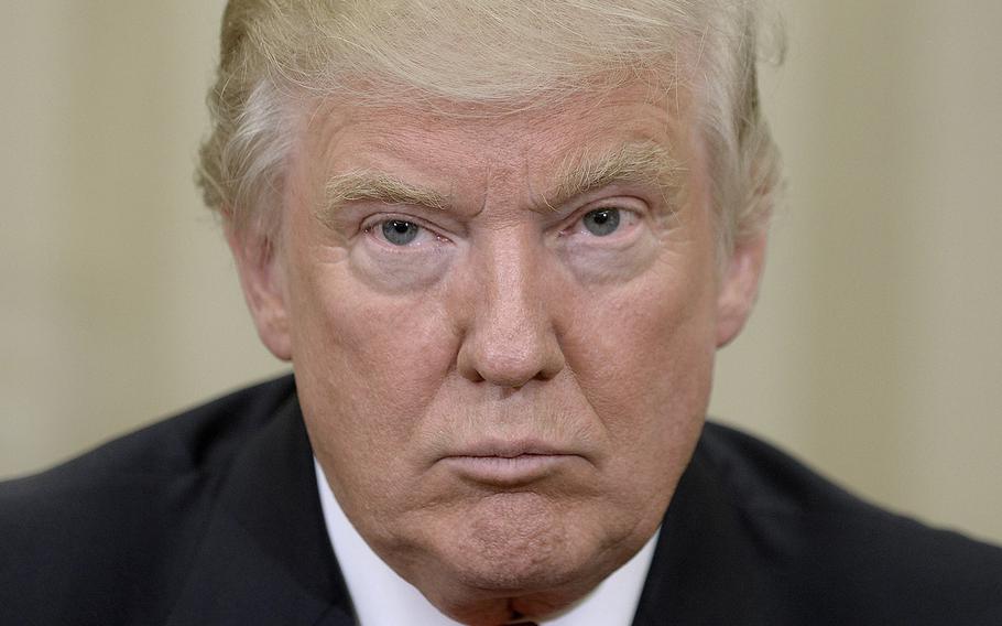President-elect Donald Trump looks on in the Oval Office of the White House on Thursday, Nov. 10, 2016 during a meeting with U.S. President Barack Obama in their first public step toward a transition of power in Washington, D.C.