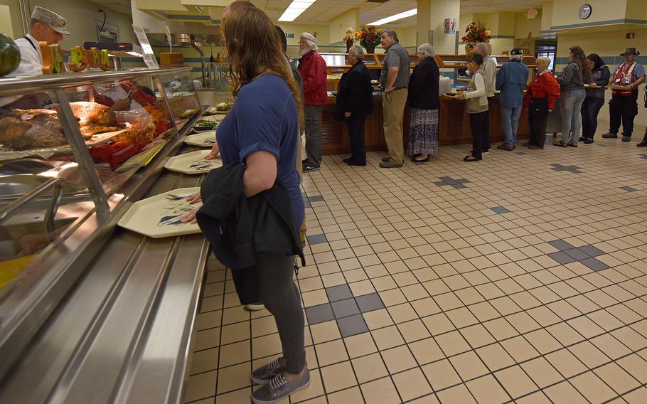 Red Cross staff members and volunteers wait in line at the dining facility at Seymour Johnson Air Force Base, North Carolina on Nov. 24, 2016. Since Hurricane Matthew, the Red Cross has sent 111 emergency response vehicles to deliver relief to hard-hit areas.