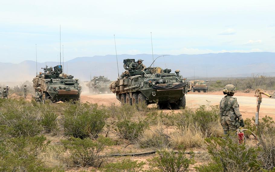 Soldiers assigned to the 1st Brigade, 1st Armored Division conduct a "refuel on the move" during Iron Focus on the Fort Bliss training area March 30, 2015.