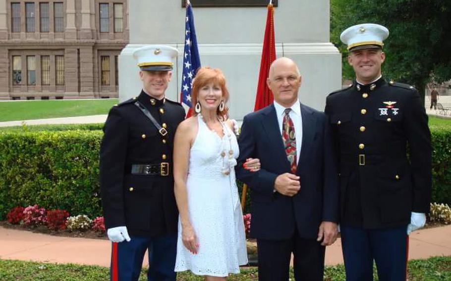 U.S. Marine Corps pilot Capt. Jake Frederick, 32, far left, was killed Wednesday in a F/A-18C crash off Japan. On Thursday, his Texas-based family remembered Jake Frederick's love of flying and his desire to be a Marine. Jake's older brother, Joe Bob Frederick, credited Jake with inspiring him to also join the Marine Corps. Joe Bob Frederick, far right, swore in Jake Frederick, left, at his commissioning ceremony on the grounds of the Texas State Capitol. Also pictured are their parents, Donna Frederick and Larry Frederick. 