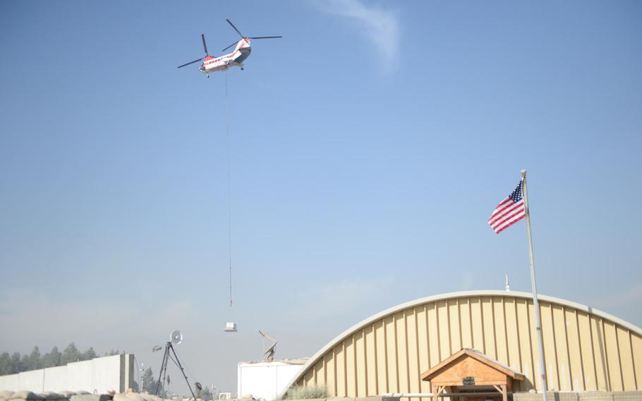 Cargo sling loaded at Bagram Air Field arrives at Forward Operating Base Gamberi near the eastern city of Jalalabad, Afghanistan, Dec. 6, 2016. Because it does not have an airfield, many essential supplies are delivered to Gamberi this way.