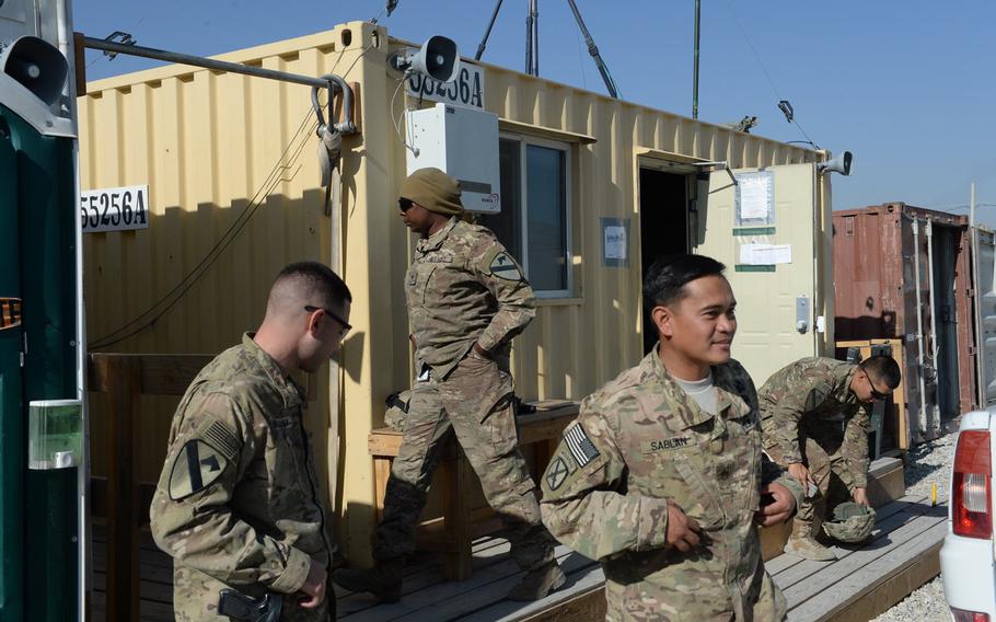 Members of the sling load detachment at Bagram Air Field get ready for their next operation on Dec. 5, 2016. From left, Capt. Brendan Kasony, Spc. Mikeal Bailey, Staff Sgt. Carlo Sablan and Spc. Eugene Lee work daily to transport essential items to smaller bases.