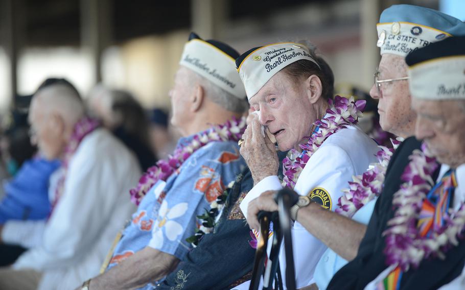 A Pearl Harbor survivor wipes tears from his eyes during the 75th Commemoration of the attack on Pearl Harbor at Kilo Pier on Joint Base Pearl Harbor-Hickam, on Dec. 7, 2016.
