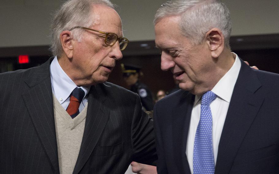 Retired Gen. Jim Mattis talks with former Sen. Sam Nunn before Mattis' secretary of Defense confirmation hearing on Capitol Hill, Jan. 12, 2017.