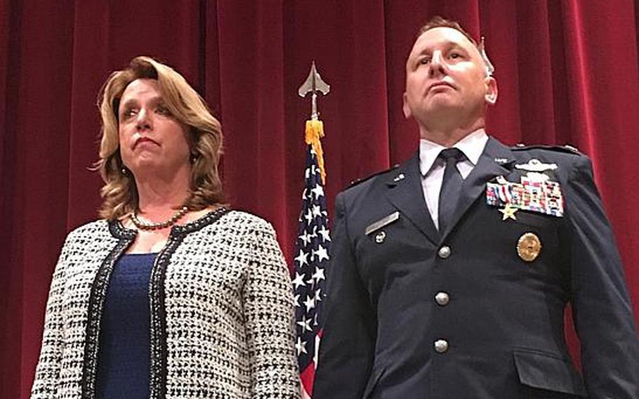 Secretary of the Air Force Deborah Lee James and Col. Chris Barnett stand as his second Silver Star citation is read for his actions in Afghanistan in 2009. 
                
