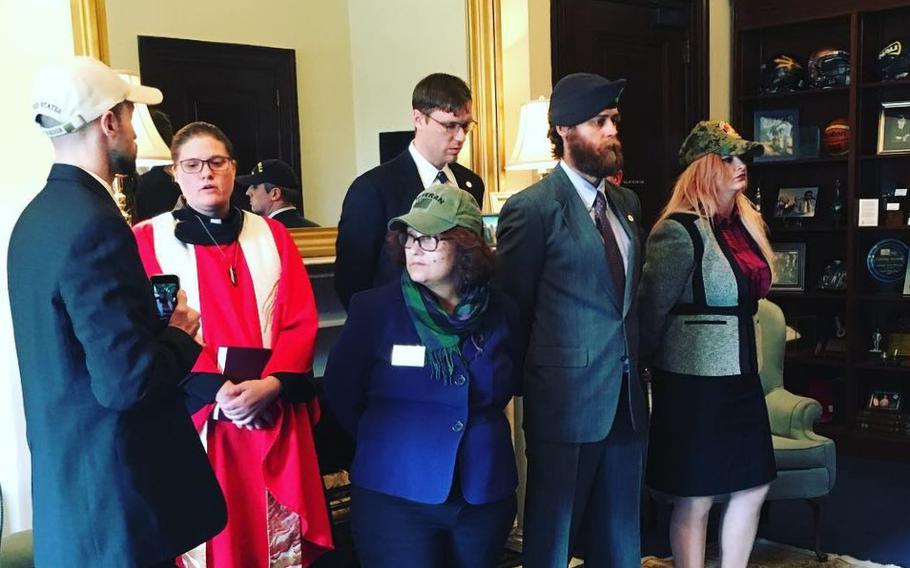 A group of veterans staging a protest vigil in Sen. John McCain's office against Rex Tillerson on Jan. 19, 2017.