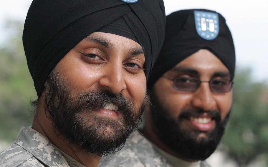 Army Lt. Col. Kamal Kalsi; left; and now-Maj. Tejdeep Rattan were the first two Sikh soldiers to receive an exemption to serve in their religiously-mandated beards and turbans in 2009. The Army has since approved at least 15 additional Sikhs to serve while maintaining their articles of faith; including eight such exemptions in the first two months of 2017.