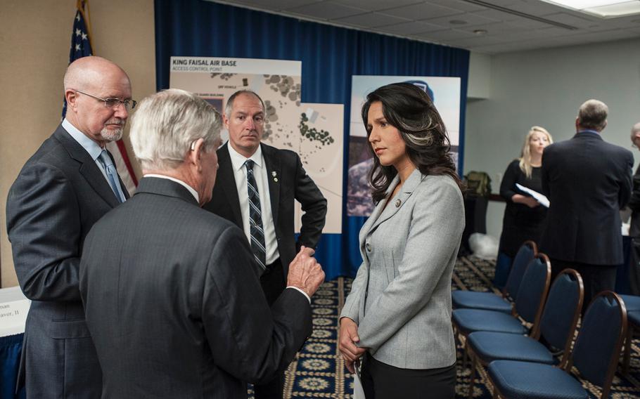 Congresswoman Tulsi Gabbard, D-Hawaii, attends a National Press Club event in Washington, D.C., on Tuesday, March 7, 2017, as the fathers of three Green Berets killed in Jordan on Nov. 4, 2016, give details of how their sons were killed. Clockwise from Gabbard's left are, James Moriarty, Sr., father of Staff Sgt. James Moriarty; Brian McEnroe, father of Staff Sgt. Kevin McEnroe; and Chuck Lewellen, father of Sgt. 1st Class Matthew Lewellen.
