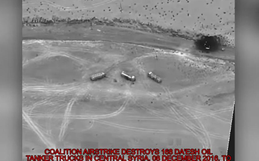 A file photo shows the aftermath of a coalition airstrike against Islamic State oil tankers near Palmyra, Syria, Dec. 8, 2016.