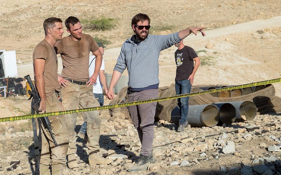 Logan Marshall-Green, Nicholas Hoult and Fernando Coimbra work behind the scenes on "Sand Castle."