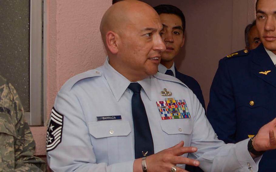 In a 2016 file photo, U.S. Air Force Chief Master Sgt. Jose Barraza speaks with Chilean air force cadets.