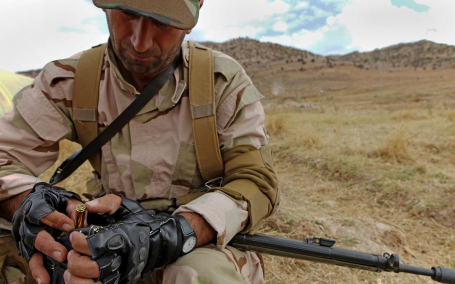 A Peshmerga soldier loads ammunition into his magazine in preparation for squad-based training near Erbil, Iraq, on Oct. 14, 2015. According to military officials, Combined Joint Task Force-Operation Inherent Resolve coalition partners had planned in 2015 to provide millions of rounds of ammunition, as well as small arms, machine guns, mortars, radios, vehicles, and other equipment over the next several months to Iraqi Security Forces. Some of this equipment has been purchased using the Iraq Train and Equip Fund.