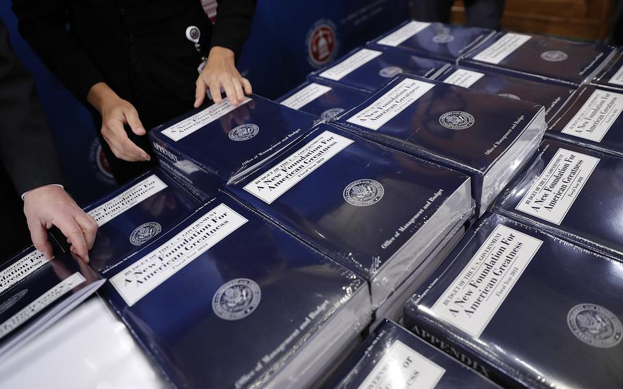 Senate Budget Committee staff members lay out copies of President Donald Trump's fiscal 2018 federal budget for distribution on Capitol Hill in Washington, Tuesday, May 23, 2017.