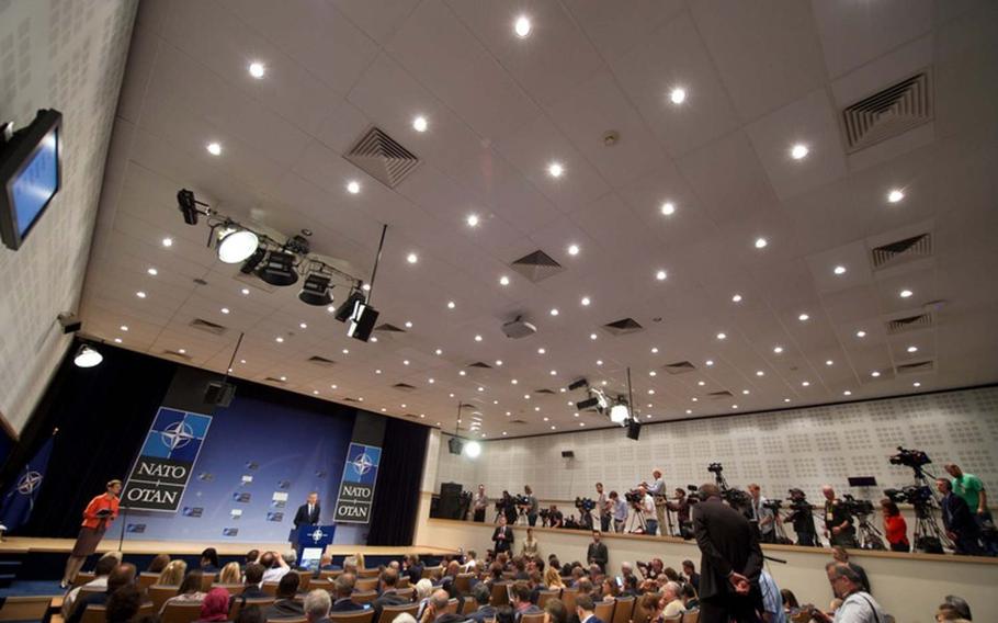 Journalists listen as NATO Secretary-General Jens Stoltenberg speaks ahead of a meeting of NATO heads of state in Brussels, Thursday, May 25, 2017.