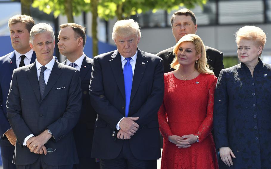 Belgian King Philippe, from left, U.S. President Donald Trump, Croatian President Kalinda Grabar-Kitarovic and Lithuanian President Dalia Grybauskaite attend a ceremony at NATO headquarters in Brussels on Thursday, May 25, 2017. 