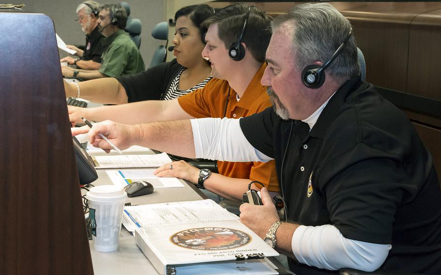 In a June, 2014 file photo, personnel at the Missile Defense Integration and Operation Center on Schriever Air Force Base in Colorado Springs, Colo., work at the test control facility during Flight Test Ground-Based Interceptor-06b.