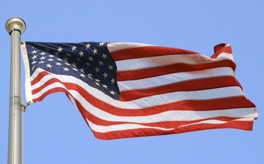 An American flag blows in the breeze.