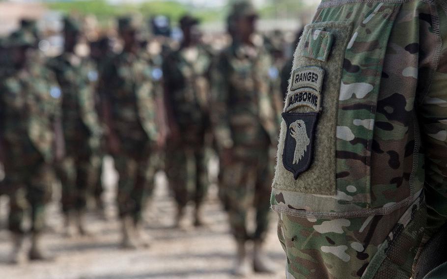 Five U.S. Army 101st Airborne soldiers deployed with U.S. Army Africa to train Somali National Army soldiers stand at a graduation formation on May 23, 2017, in Mogadishu, Somalia.