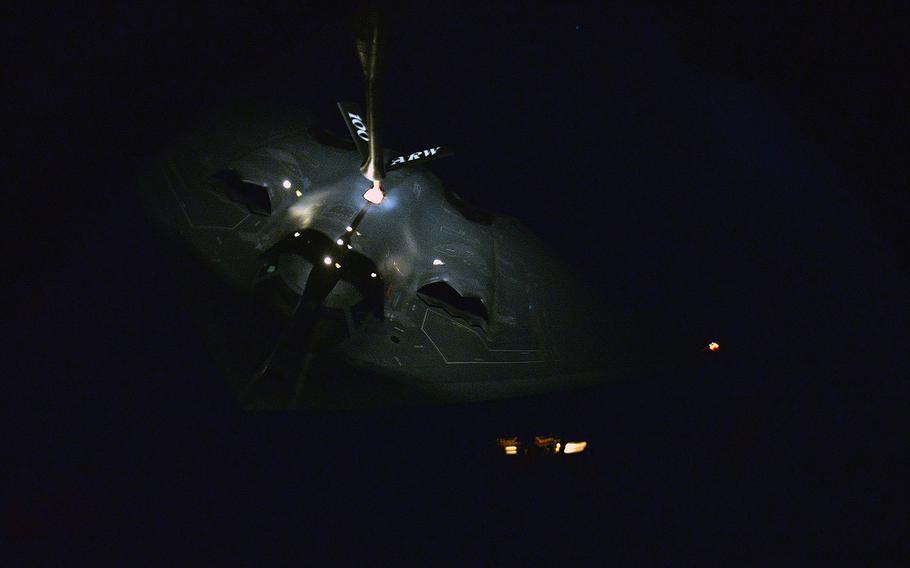 A KC-135 Strantotanker from the 100th Air Refueling Wing refuels a B-2 Spirit from the 509th Bomb Wing in the late hours of Jan. 18, 2017, during a mission that targeted Islamic State training camps in Libya. 