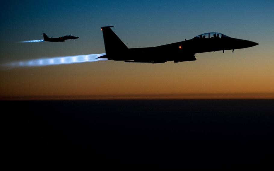 A pair of U.S. Air Force F-15E Strike Eagles fly over northern Iraq early in the morning of Sept. 23, 2014, after conducting airstrikes in Syria.