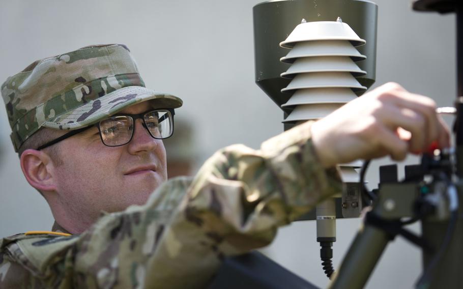 Airman 1st Class Andrew Boos assembles a Tactical Meteorological Observing System during a timed certification test at McCully Barracks, Germany, on Wednesday, June 14, 2017.
                