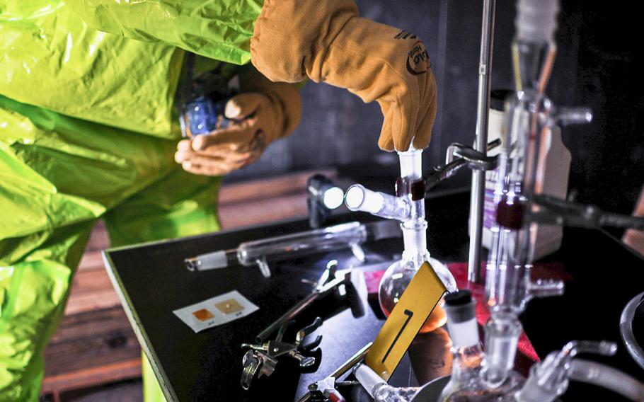 An Illinois National Guardsman collects a sample from a sarin lab during a weapon of mass destruction exercise in Peoria, Ill., on June 8, 2014. A report released in June 2017 found that officials at the Army’s Dugway Proving Ground in Utah and a contractor that facility was using to care for chemicals did not properly inventory its sarin.
