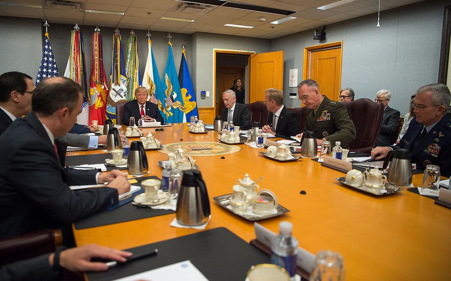 President Donald Trump with members of the National Security Council before a meeting at the Pentagon on July 20, 2017.