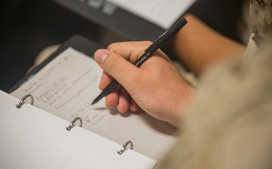 A recruit with Delta Company, 1st Recruit Training Battalion, takes notes during a class for educational benefits Aug. 26, 2015, on Parris Island, S.C.