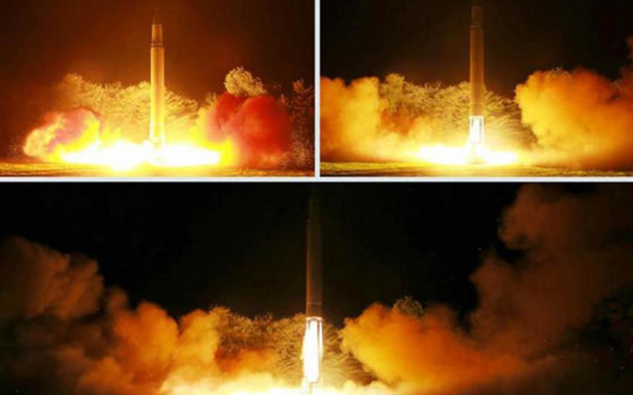 These undated images published in the July 31, 2017, edition of North Korea's Rodong Sinmun newspaper purport to show the launch of an intercontinental ballistic missile late Friday.