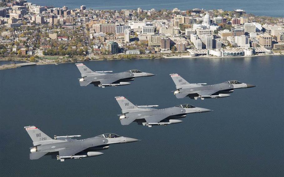 Four F-16C Fighting Falcons from the Wisconsin Air National Guard fly over the capital city of Madison, Wis., in 2008.