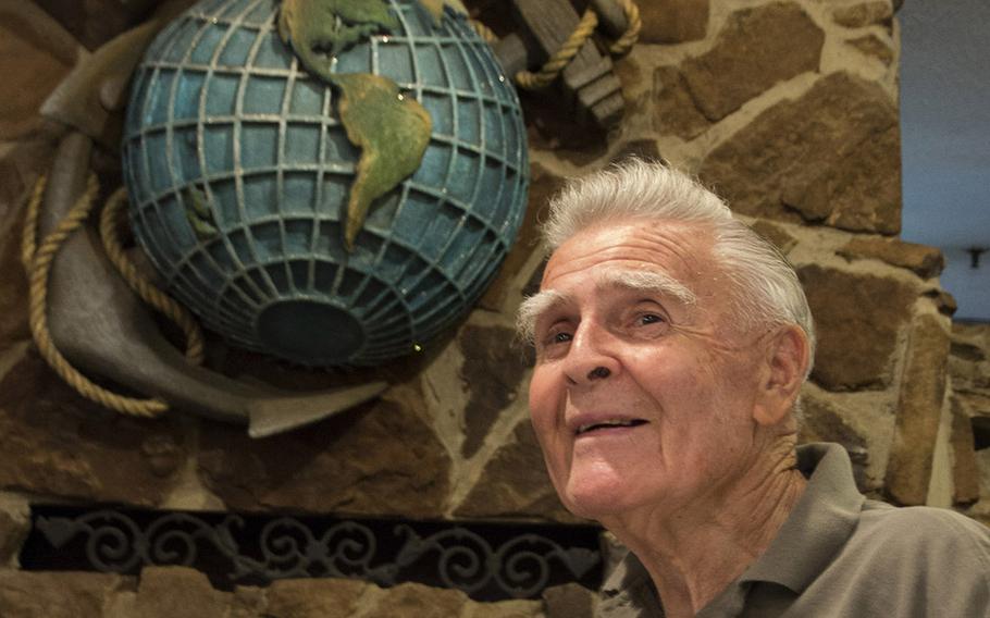Retired U.S. Marine Corps Maj. John Fasulo poses in front of the eagle, globe and anchor at the Marine-themed Globe and Laurel Restaurant in Stafford, Va., in June, 2017.