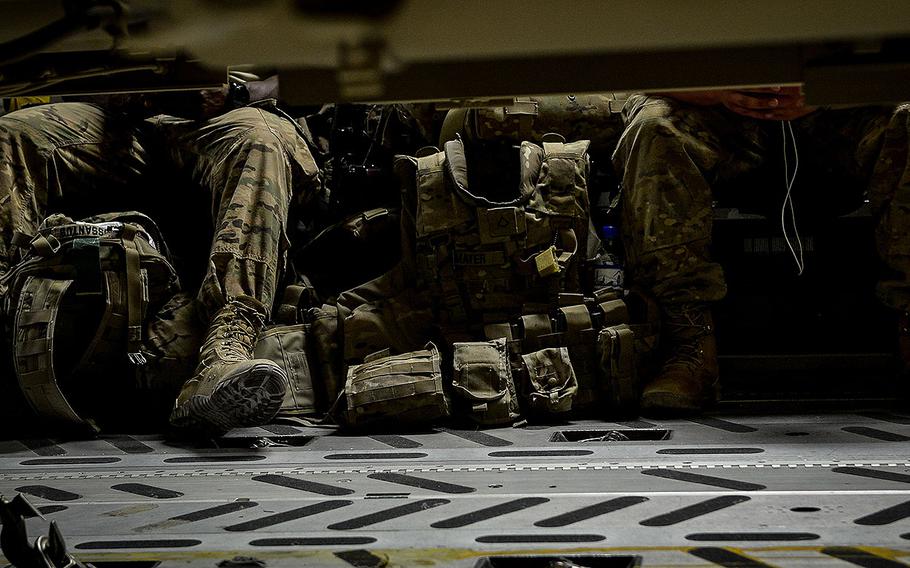 Passengers aboard a C-17 Globemaster III wait while cargo is loaded during a mission in support of Operation Inherent Resolve, Aug. 23, 2017, at Bagram Airfield, Afghanistan.