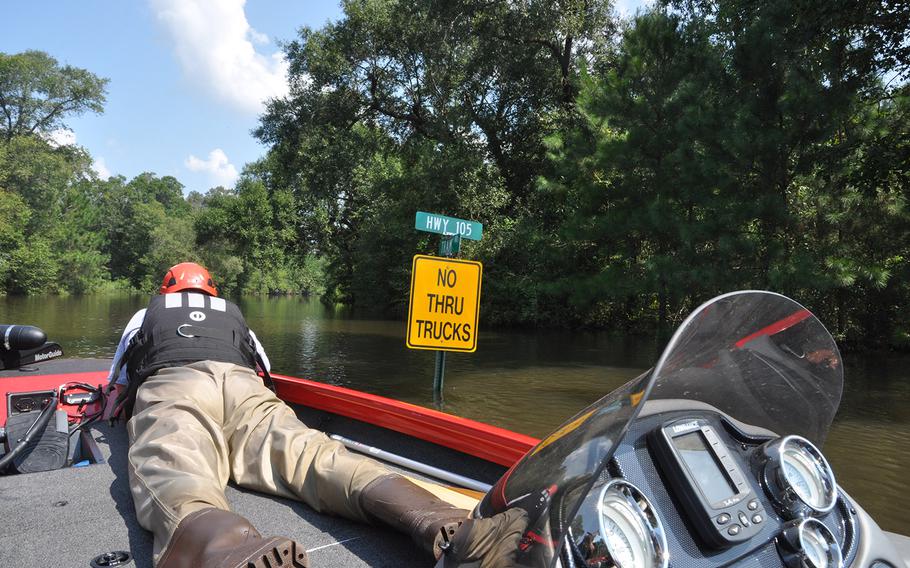 Team Rubicon volunteer Anthony DiToma of Dallas keeps an eye out for debris in the floodwaters in Beaumont, Texas on Sept. 2, 2017. DiToma and his team were out searching door to door – or roof to roof – for people or pets trapped by water.