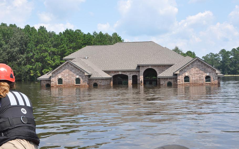 Flooding in a Beaumont, Texas neighborhood near the Pine Island Bayou left homes underwater and vehicles submerged. The water was still high on Sept. 2, 2017, but had started to recede.