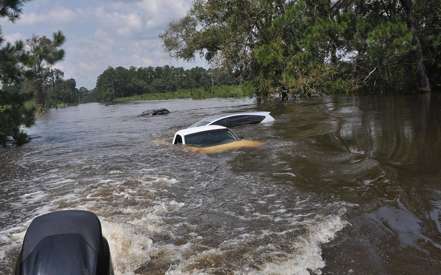 Flooding in a Beaumont, Texas neighborhood near the Pine Island Bayou left homes underwater and vehicles submerged. The water was still high on Sept. 2, 2017, but had started to recede.