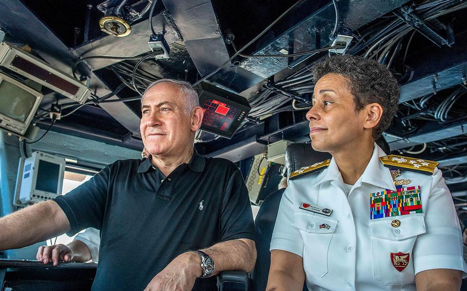 Israeli Prime Minister Benjamin Netanyahu, left, speaks with Commander, Naval Forces Europe, Adm. Michelle Howard about U.S. military operations on the bridge of the aircraft carrier USS George H.W. Bush during a visit to the ship in Haifa, Israel on July 3, 2017.
