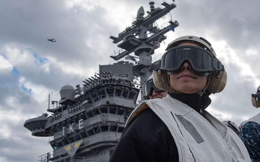 Commander, U.S. Naval Forces Europe-Africa, Adm. Michelle Howard, observes operations on the flight deck of the aircraft carrier USS Dwight D. Eisenhower in the Mediterranean Sea on Dec. 21, 2016.