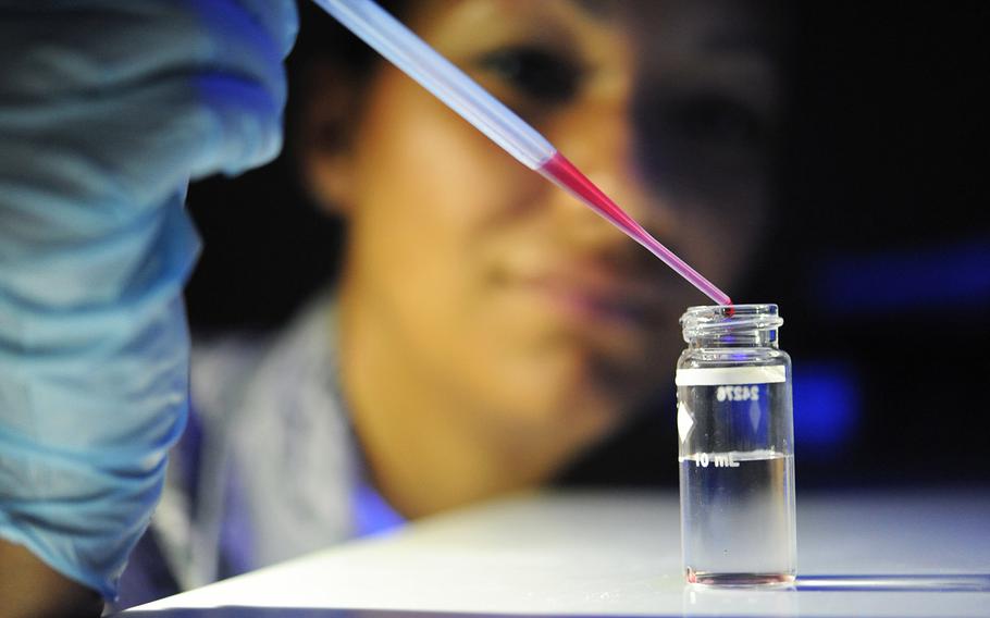 U.S. Air Force Staff Sgt. Amber Metts, 19th Aerospace Medicine Squadron Bioenvironmental, checks the pH level in a water sample May 18, 2017, at Little Rock Air Force Base, Ark. The purpose of the test is to check for harmful contaminants in the water.
